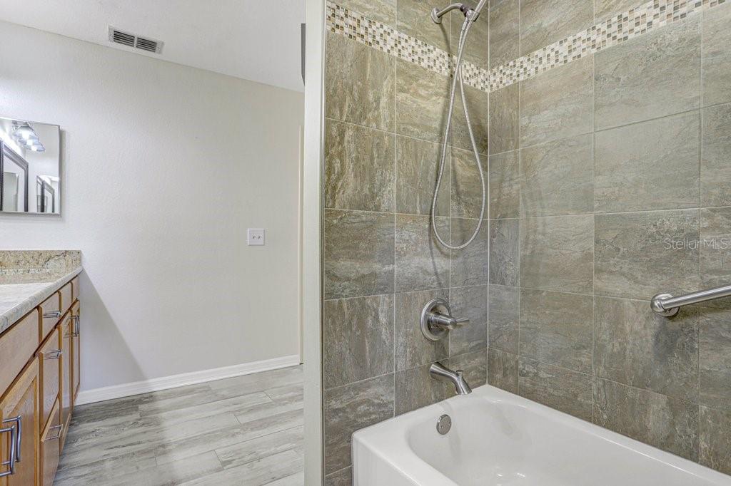 504 Triple Crown Court Seffner, FL 33584 - Photo 51 of 63 a bathroom with a sink a toilet and shower