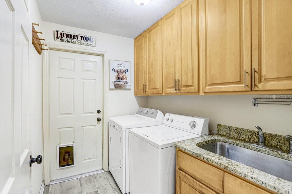 504 Triple Crown Court Seffner, FL 33584 - Photo 53 of 63 a utility room with dryer and washer