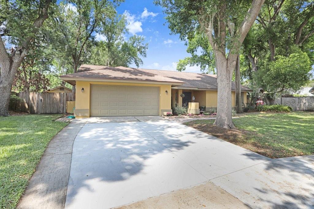 504 Triple Crown Court Seffner, FL 33584 - Photo 55 of 63 a view of a house with a yard