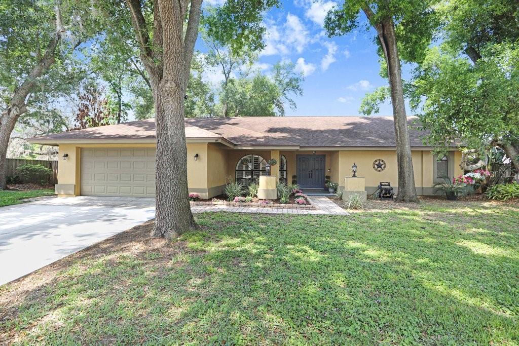 504 Triple Crown Court Seffner, FL 33584 - Photo 56 of 63 a front view of a house with garden
