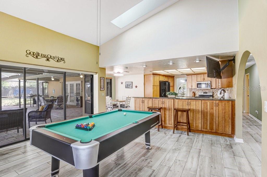 504 Triple Crown Court Seffner, FL 33584 - Photo 6 of 63 a room with pool table and windows