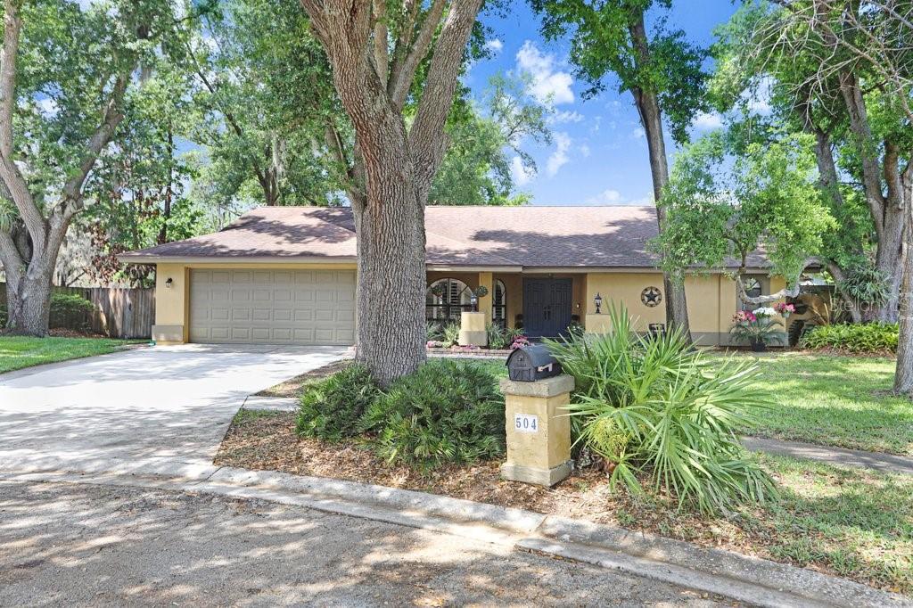 504 Triple Crown Court Seffner, FL 33584 - Photo 10 of 63 a front view of a house with garden