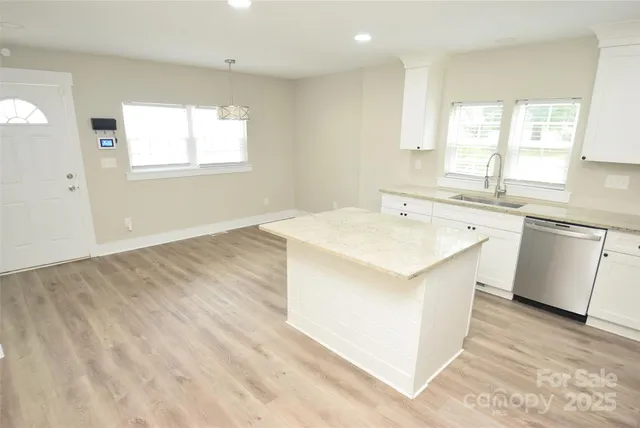 a bedroom with bed and a window