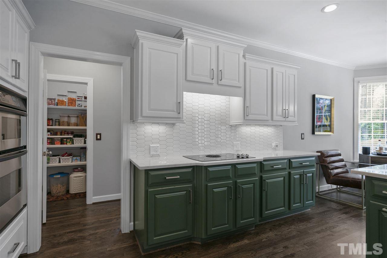 12205 Arneson Street Raleigh, NC 27614 - Photo 14 of 30 Stunning kitchen with quartzite countertops, beautiful cabinets, new refrigerator, dishwasher, pantry