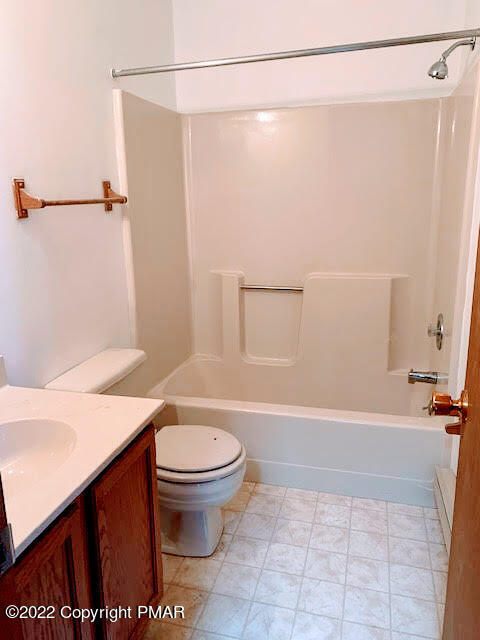 139 Dunchurch Drive Bushkill, PA 18324 - Photo 11 of 12 a bathroom with a sink a toilet and a shower