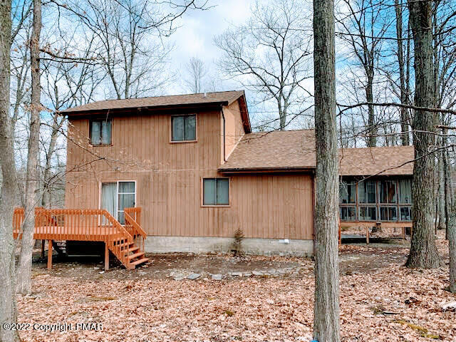 139 Dunchurch Drive Bushkill, PA 18324 - Photo 2 of 12 a backyard of a house with barbeque oven table and chairs