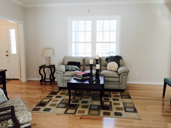 348 River Road, Unit A2 Andover, MA 01810 - Photo 3 of 8 a living room with furniture and a rug