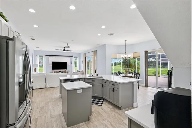 a kitchen with a sink stove and refrigerator