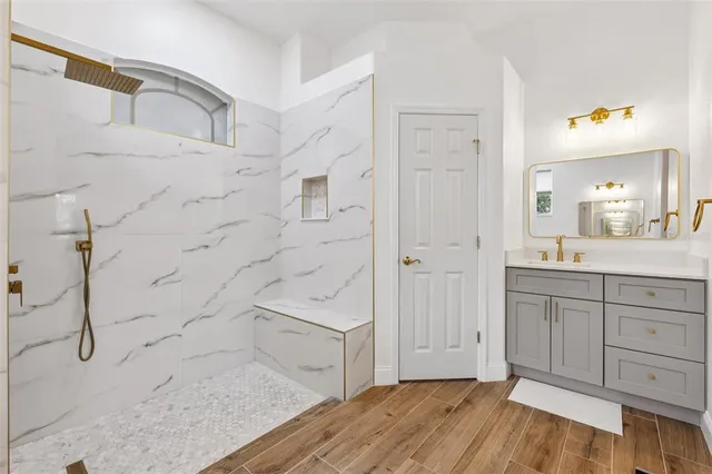 a bathroom with a sink and mirror