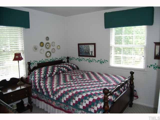 613 Northclift Drive Raleigh, NC 27609 - Photo 7 of 12 Both guest/children's bedroom have neutral carpet and plenty of windows.