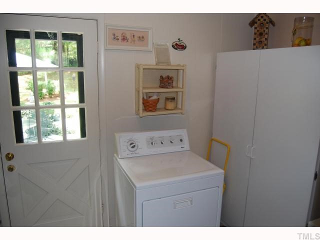 613 Northclift Drive Raleigh, NC 27609 - Photo 8 of 12 Laundry room is oversized and allows access to the backyard.