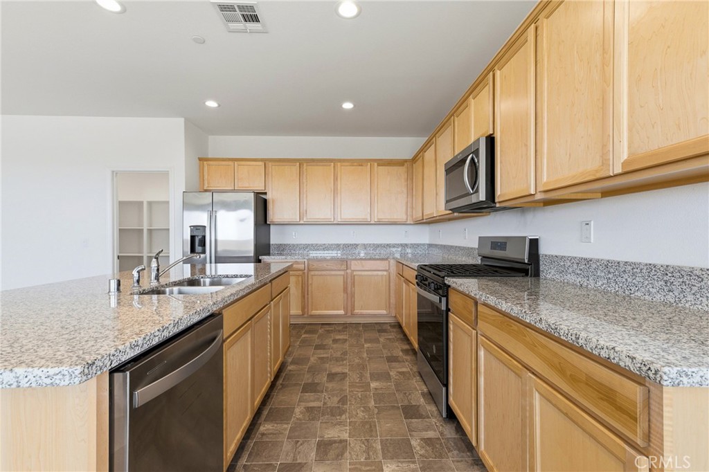 711 Ballesteros Street Perris, CA 92571 - Photo 30 of 39 Kitchen angle