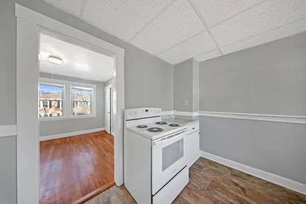 a kitchen with a stove and a microwave