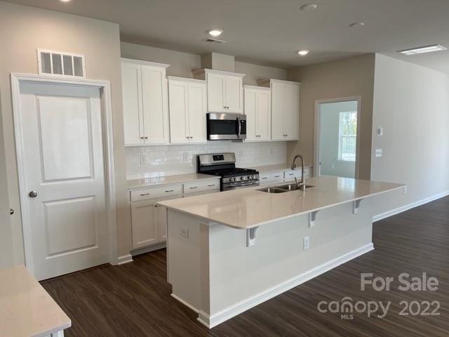 6525 Gopher Road, Unit 361 Lancaster, SC 29720 - Photo 4 of 26 a kitchen with stainless steel appliances granite countertop a stove a sink and a refrigerator