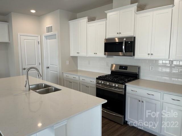 6525 Gopher Road, Unit 361 Lancaster, SC 29720 - Photo 5 of 26 a kitchen with granite countertop a sink a stove and cabinets