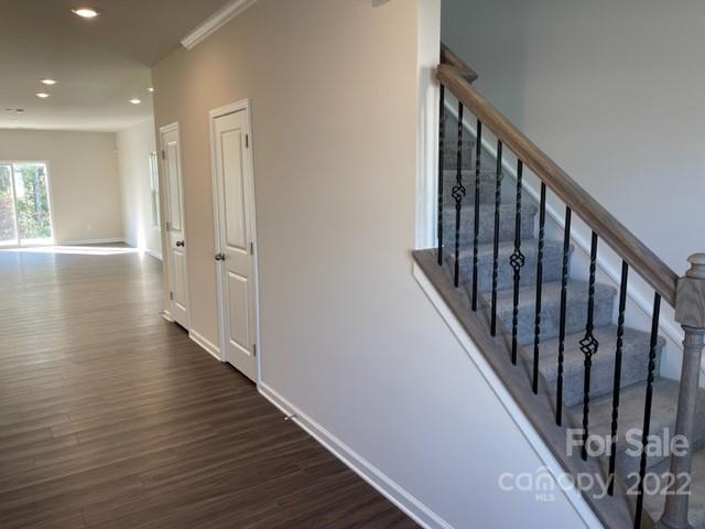 6525 Gopher Road, Unit 361 Lancaster, SC 29720 - Photo 6 of 26 a view of a hallway with wooden floor and staircase