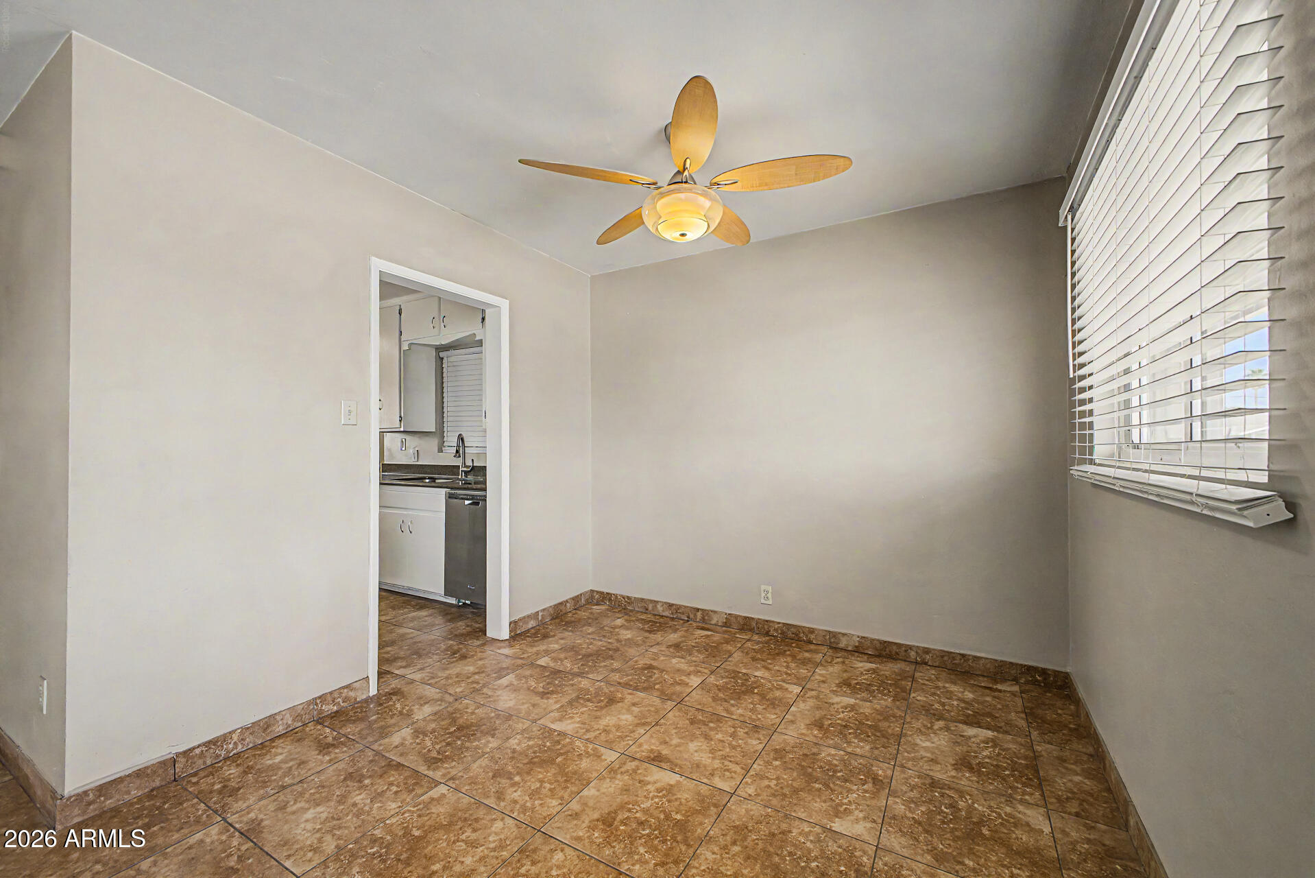2022 East Monterey Way Phoenix, AZ 85016 - Photo 7 of 29 an empty room with windows and fan