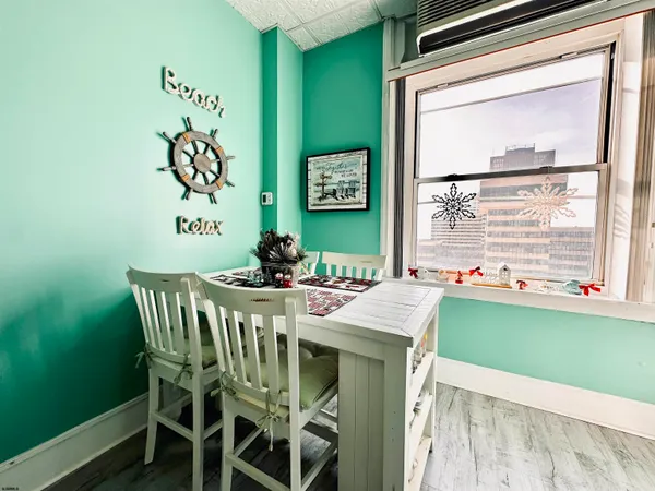 a dining room with furniture and window