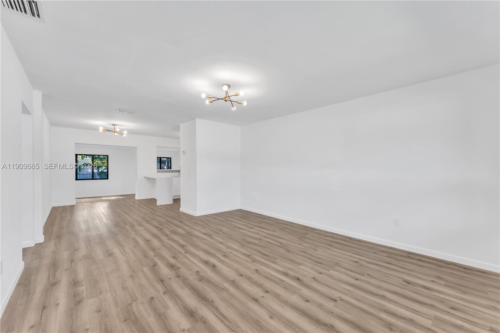 3040 Northwest 96th Street Miami, FL 33147 - Photo 12 of 26 a view of empty room with wooden floor