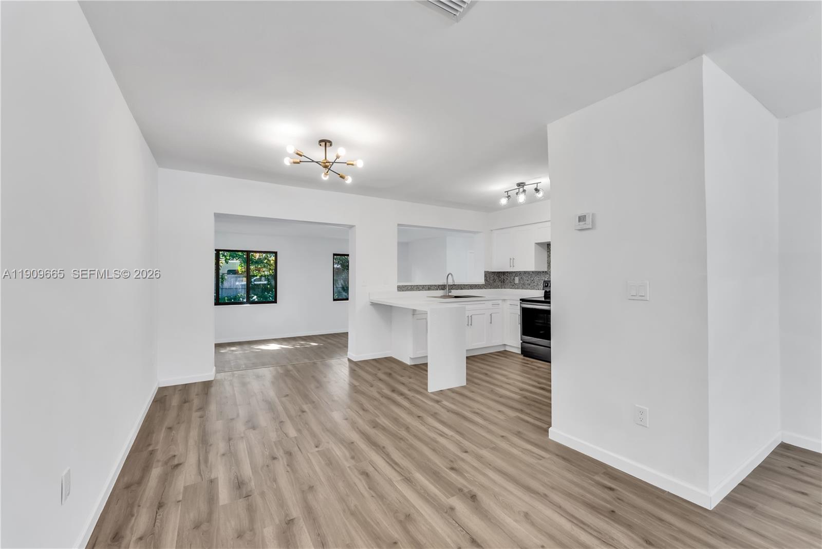 3040 Northwest 96th Street Miami, FL 33147 - Photo 15 of 26 a view of kitchen view with wooden floor and a kitchen
