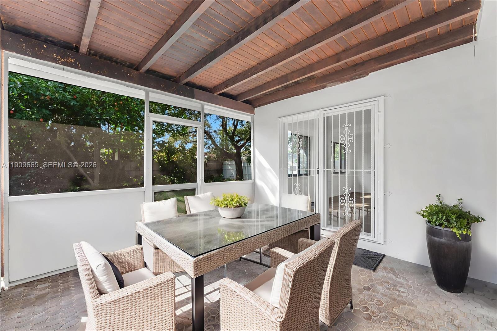 3040 Northwest 96th Street Miami, FL 33147 - Photo 16 of 26 a view of a dining room with furniture window and outside view
