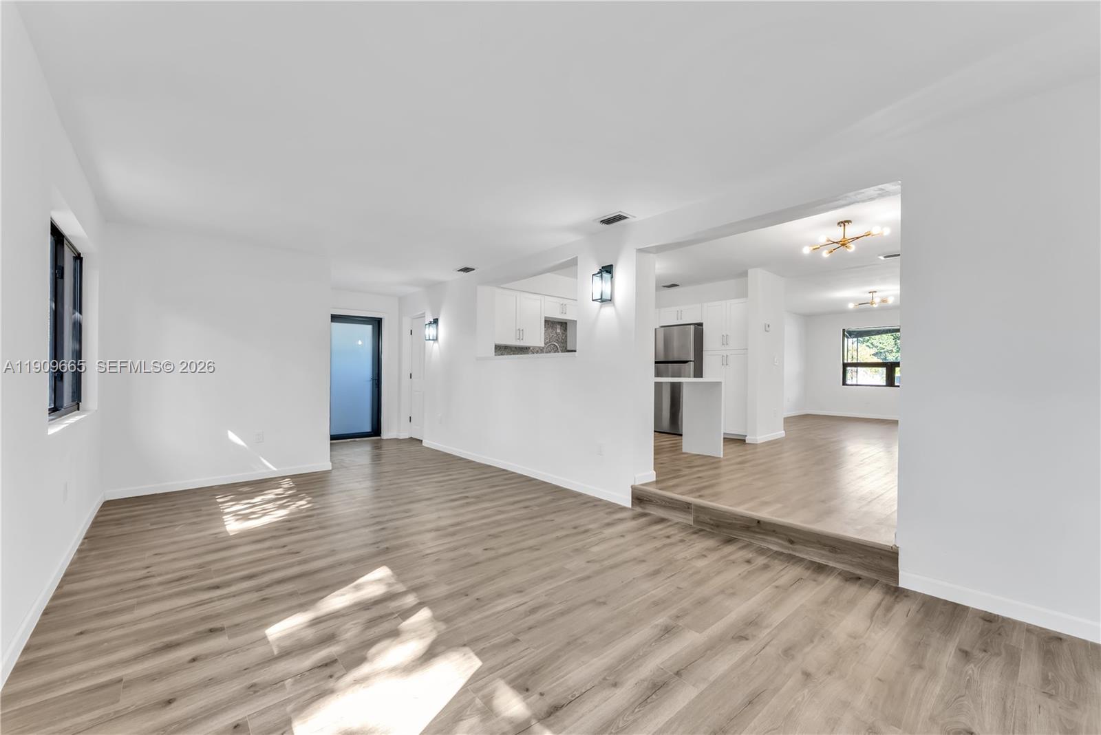 3040 Northwest 96th Street Miami, FL 33147 - Photo 17 of 26 a view of empty room with wooden floor