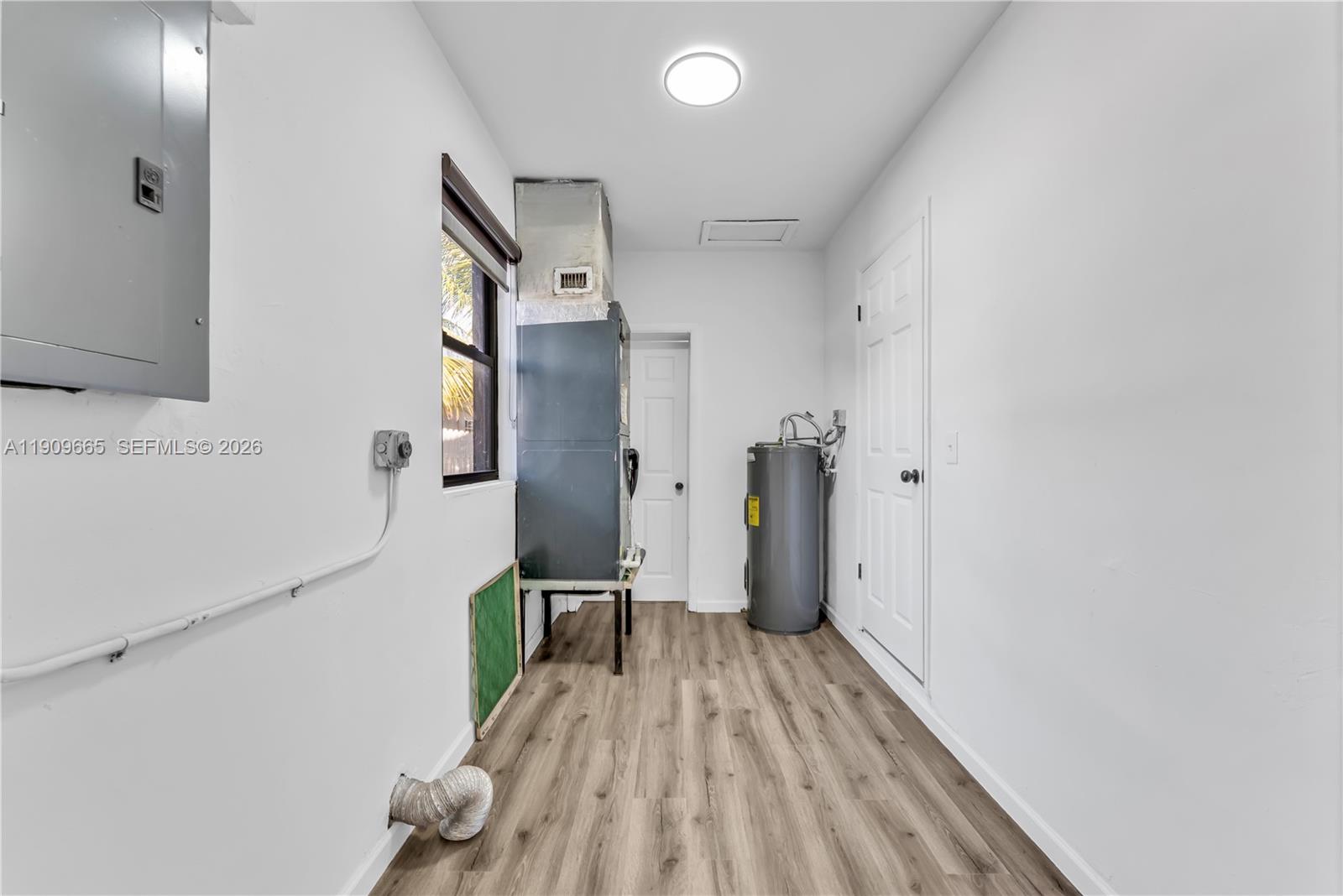 3040 Northwest 96th Street Miami, FL 33147 - Photo 26 of 26 a view of hallway with wooden floor