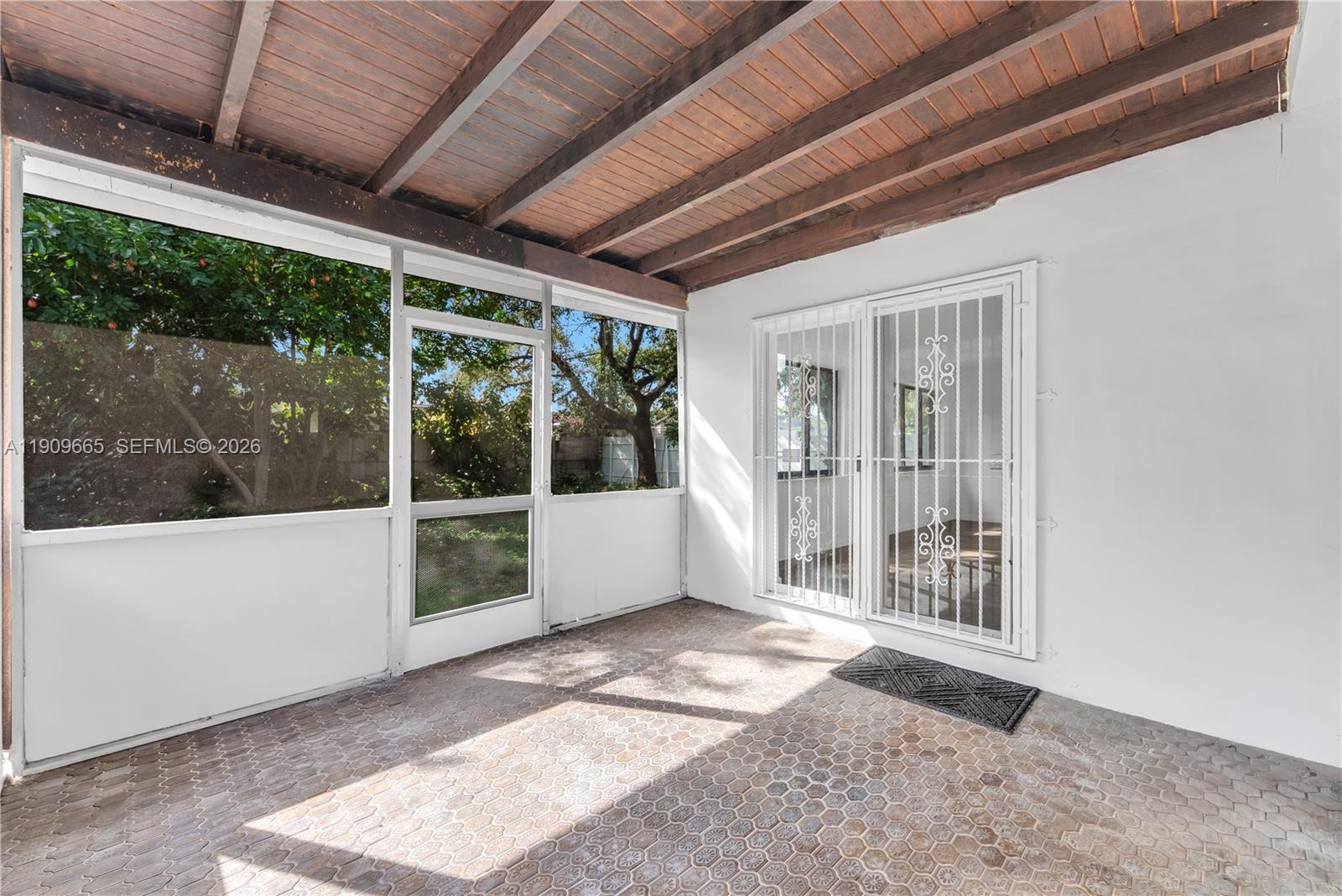 3040 Northwest 96th Street Miami, FL 33147 - Photo 6 of 26 a view of a porch with furniture