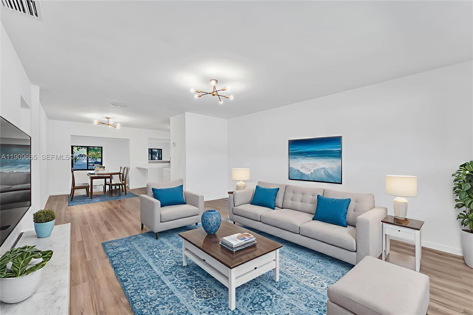 3040 Northwest 96th Street Miami, FL 33147 - Photo 10 of 26 a living room with furniture a rug and a lamp