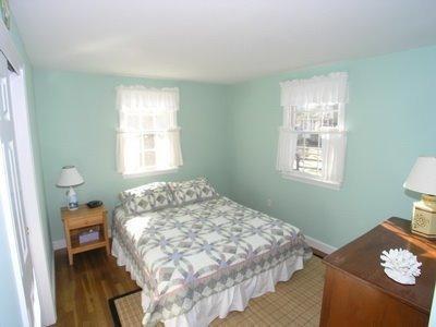 5 Wood Road Dennis Port, MA 02639 - Photo 5 of 7 a bedroom with a bed and a window