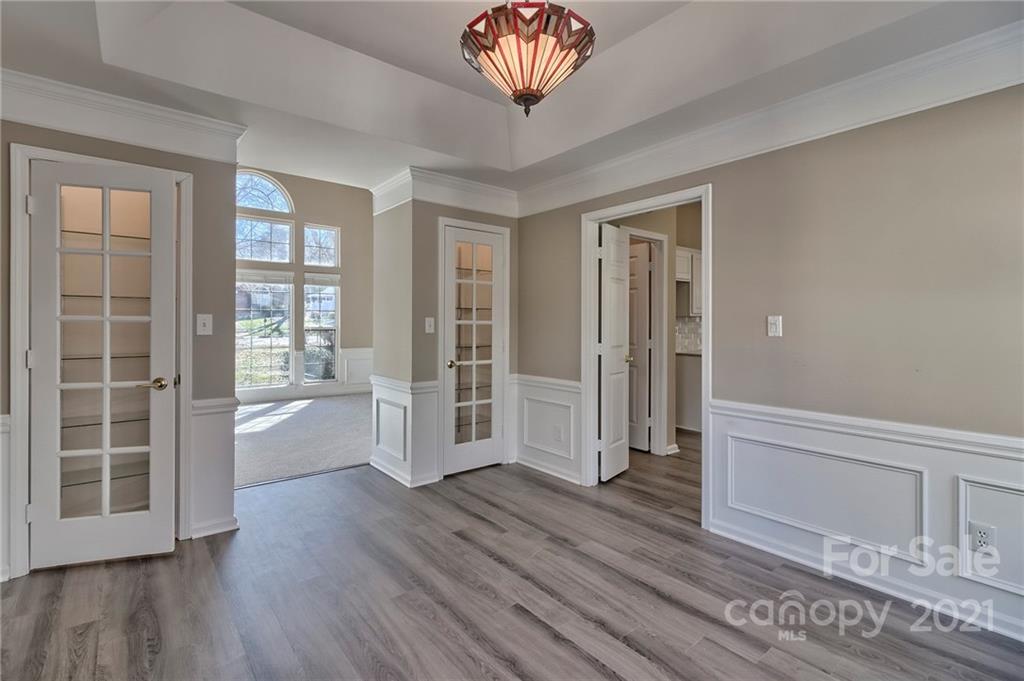 4821 Brownes Ferry Road Charlotte, NC 28269 - Photo 11 of 37 wooden floor in an empty room with a window