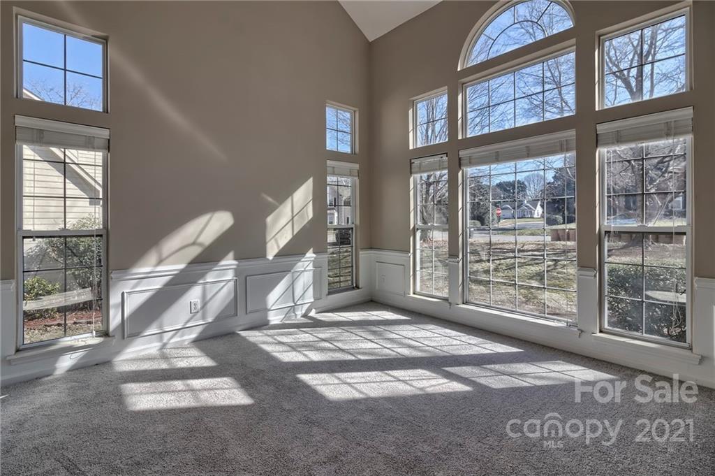 4821 Brownes Ferry Road Charlotte, NC 28269 - Photo 13 of 37 a view of an empty room with a floor to ceiling window