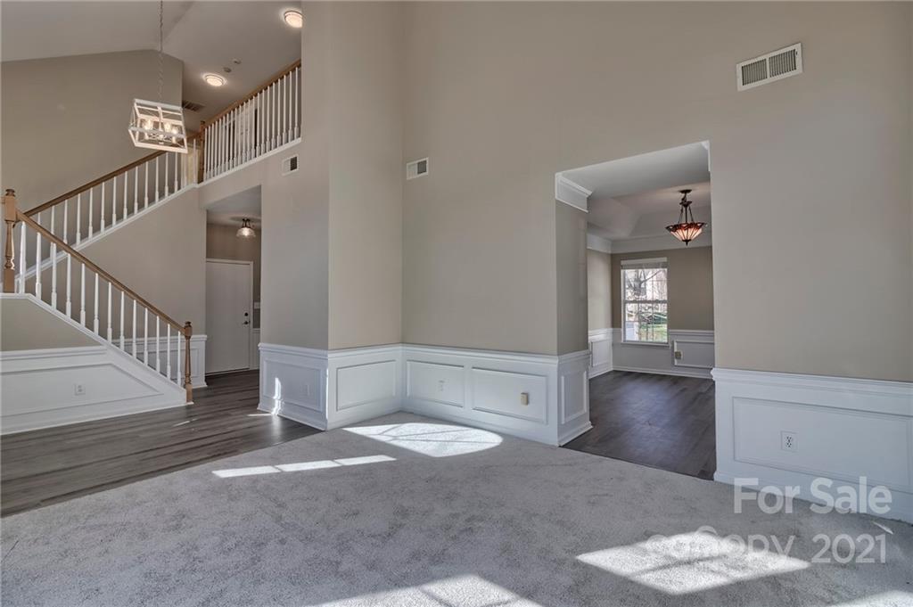 4821 Brownes Ferry Road Charlotte, NC 28269 - Photo 15 of 37 a view of entryway and hall with wooden floor