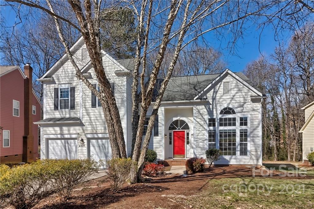 4821 Brownes Ferry Road Charlotte, NC 28269 - Photo 2 of 37 a front view of a house with a yard