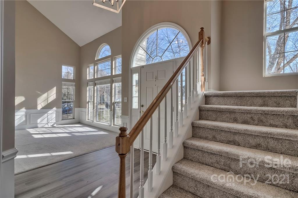 4821 Brownes Ferry Road Charlotte, NC 28269 - Photo 27 of 37 a view of entryway and hall with wooden floor