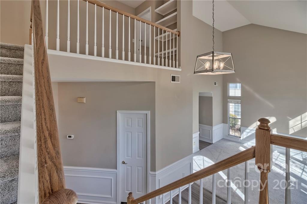 4821 Brownes Ferry Road Charlotte, NC 28269 - Photo 28 of 37 a view of a hallway with staircase