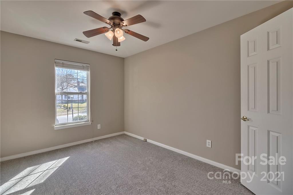 4821 Brownes Ferry Road Charlotte, NC 28269 - Photo 34 of 37 a view of a livingroom with a ceiling fan and window