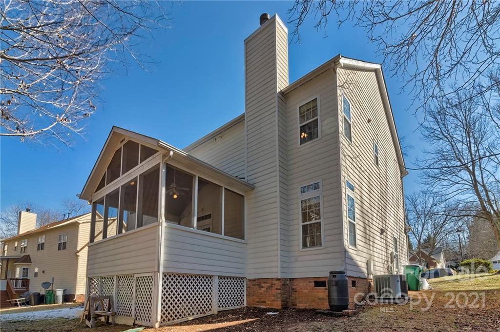 4821 Brownes Ferry Road Charlotte, NC 28269 - Photo 36 of 37 a view of a house with a yard