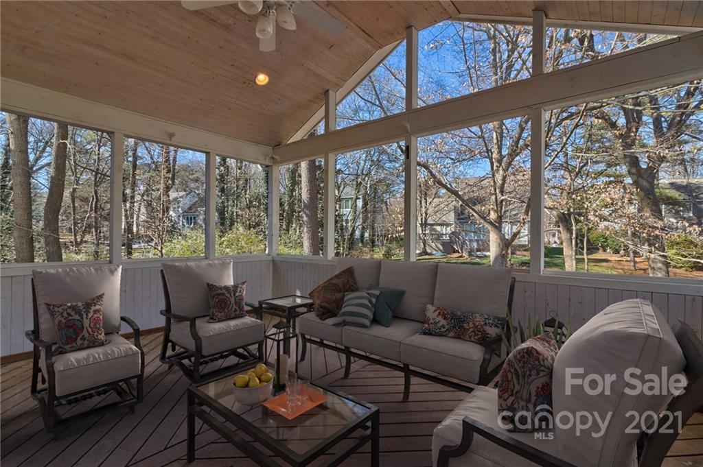 4821 Brownes Ferry Road Charlotte, NC 28269 - Photo 5 of 37 a living room with furniture and a large window
