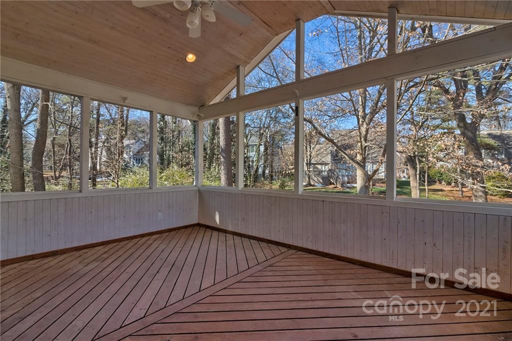 4821 Brownes Ferry Road Charlotte, NC 28269 - Photo 6 of 37 a view of empty room with wooden floor and fan