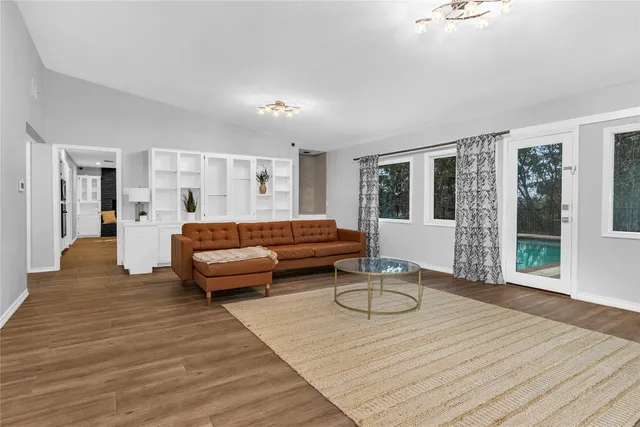 a living room with furniture and a table