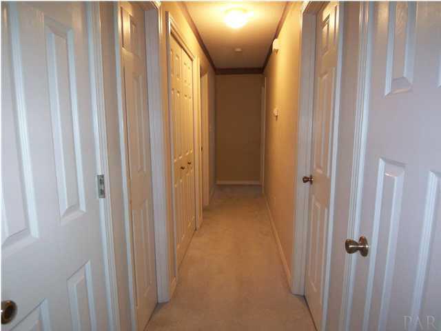 5730 Frank Reeder Road Pensacola, FL 32526 - Photo 11 of 24 View of hallway with fresly painted doors in closets.