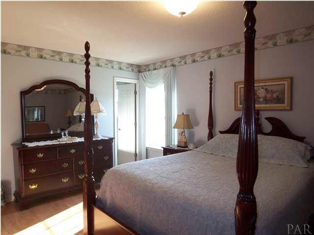 5730 Frank Reeder Road Pensacola, FL 32526 - Photo 12 of 24 Spacious master bedroom with window view of back yard and walk-in closet