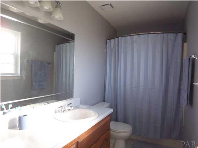 5730 Frank Reeder Road Pensacola, FL 32526 - Photo 13 of 24 Master bath with large counter space, new lighting and new Armstrong vinyl flooring.