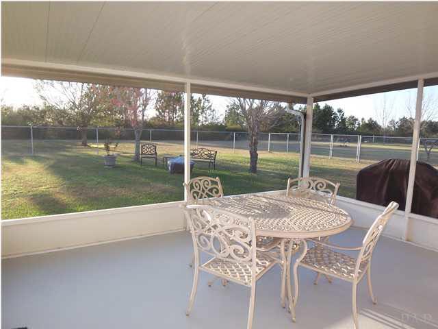 5730 Frank Reeder Road Pensacola, FL 32526 - Photo 19 of 24 Screened back porch and backyard also there is a 7x7 open patio for grill
