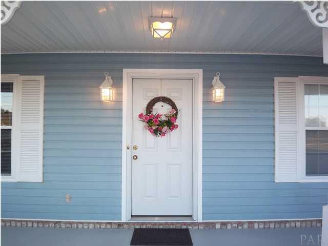 5730 Frank Reeder Road Pensacola, FL 32526 - Photo 23 of 24 Fiberglass front door installed in 2006. New windows and new lighting throughout the house.