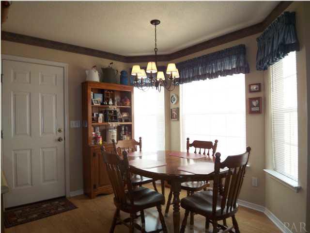 5730 Frank Reeder Road Pensacola, FL 32526 - Photo 5 of 24 Breakfast area with Bay window and laminate flooring.