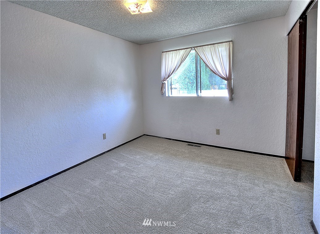 10020 Northeast 204th Street Bothell, WA 98011 - Photo 14 of 30 an empty room with a window