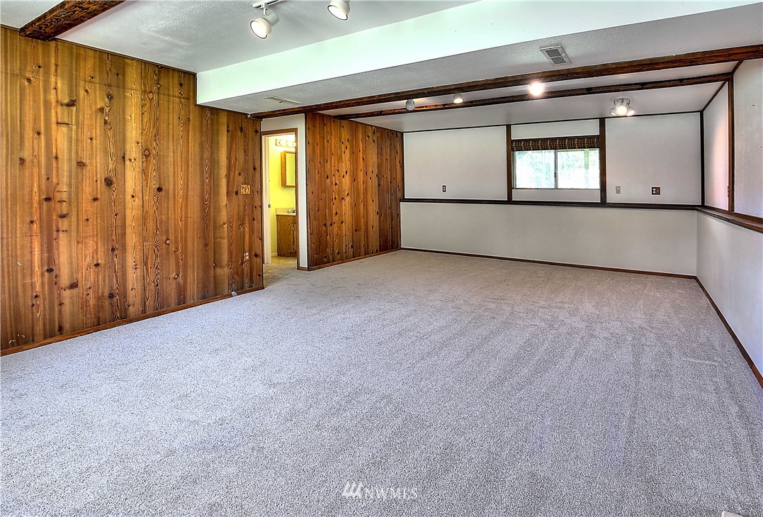 10020 Northeast 204th Street Bothell, WA 98011 - Photo 17 of 30 a view of a hallway with wooden floor and windows