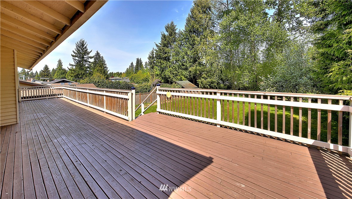10020 Northeast 204th Street Bothell, WA 98011 - Photo 22 of 30 a view of balcony with wooden floor and fence
